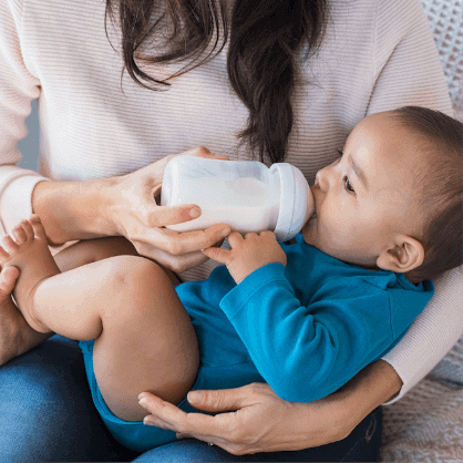 infant with bottle