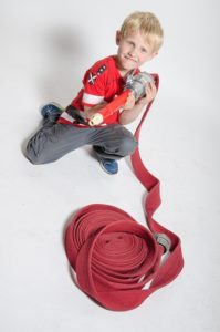 child playing with fire hose