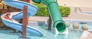 girl on slide in pool