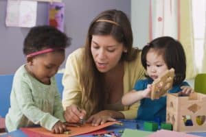 woman coloring with children