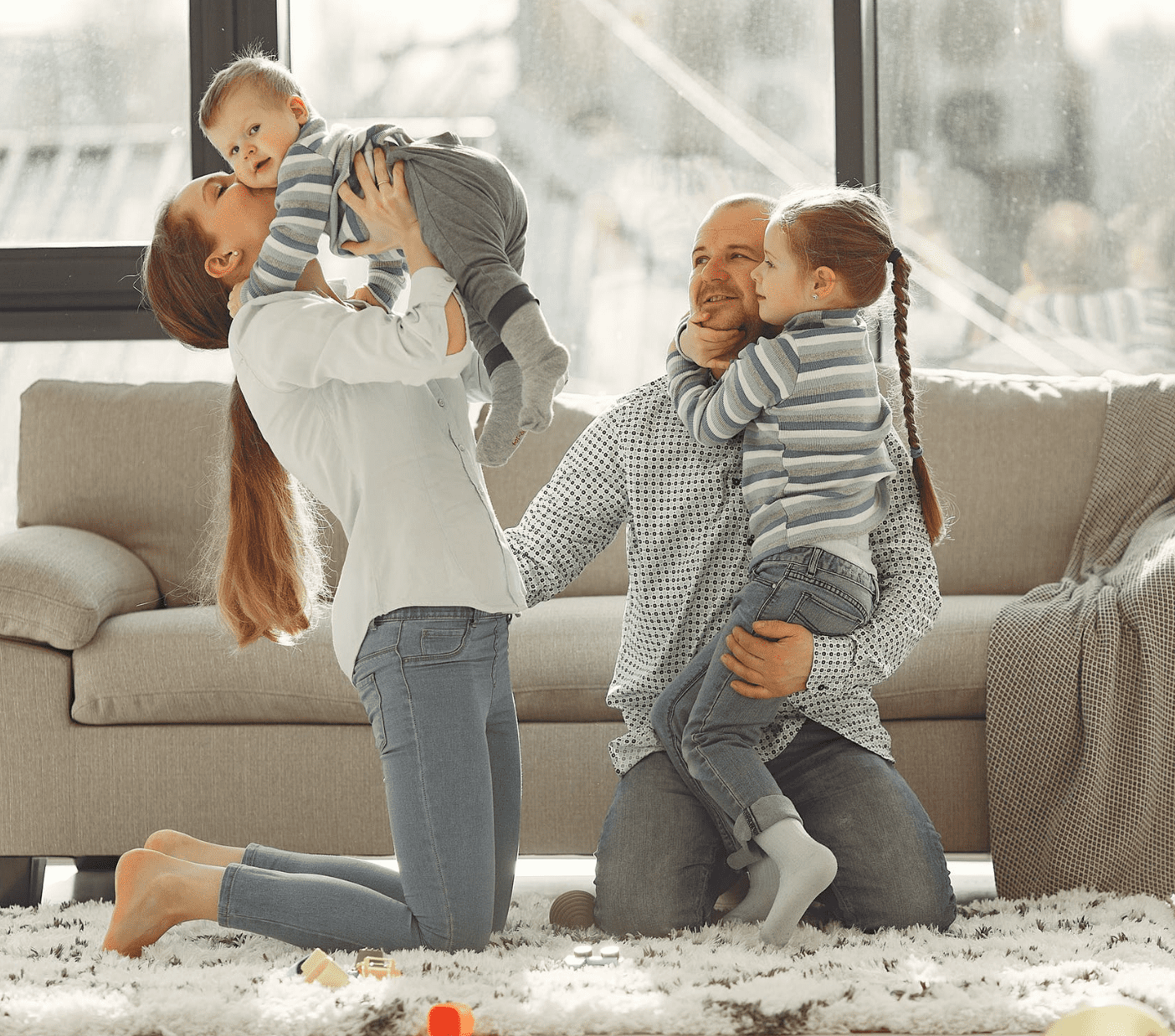 Family hanging out and playing in the living room