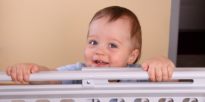 young child in front of a baby gate