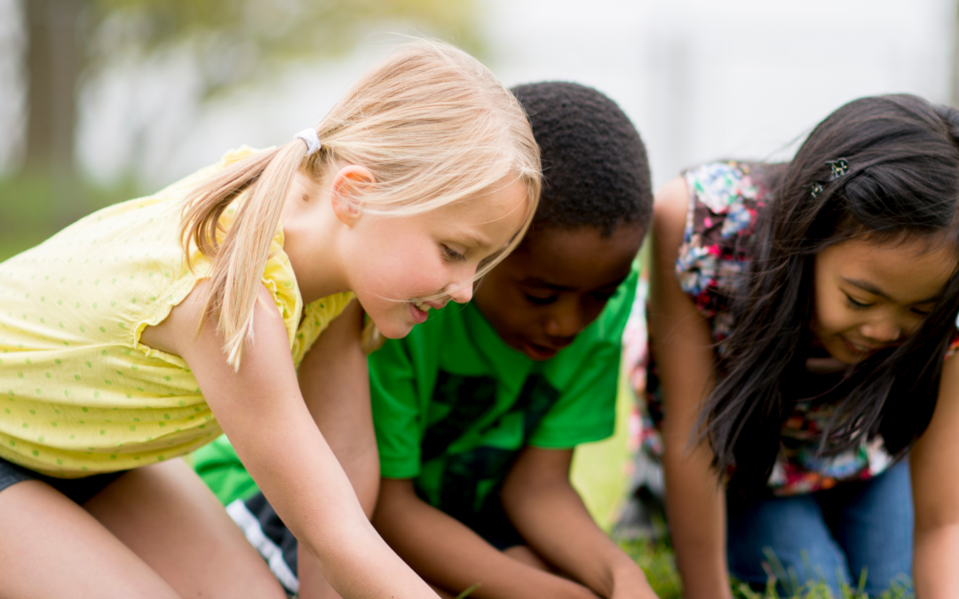 three girls playing in dirt